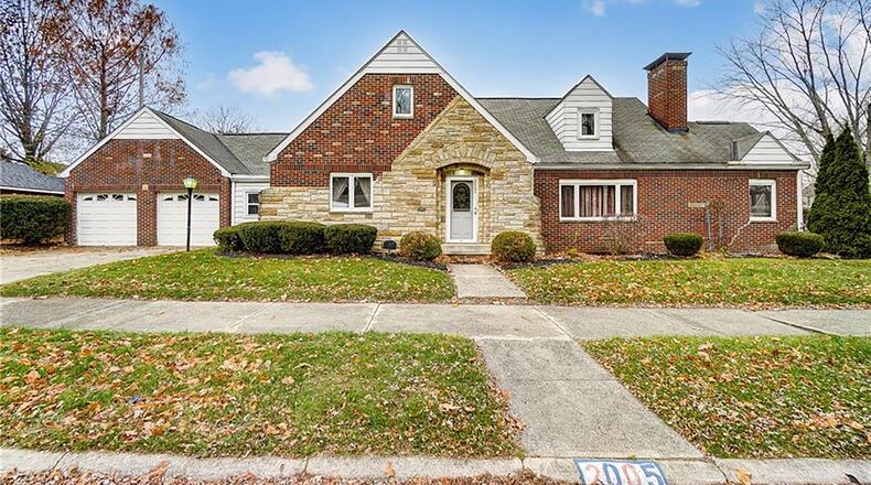 The front of the brick home has a concrete walk and a two-car attached garage. Contributed photos