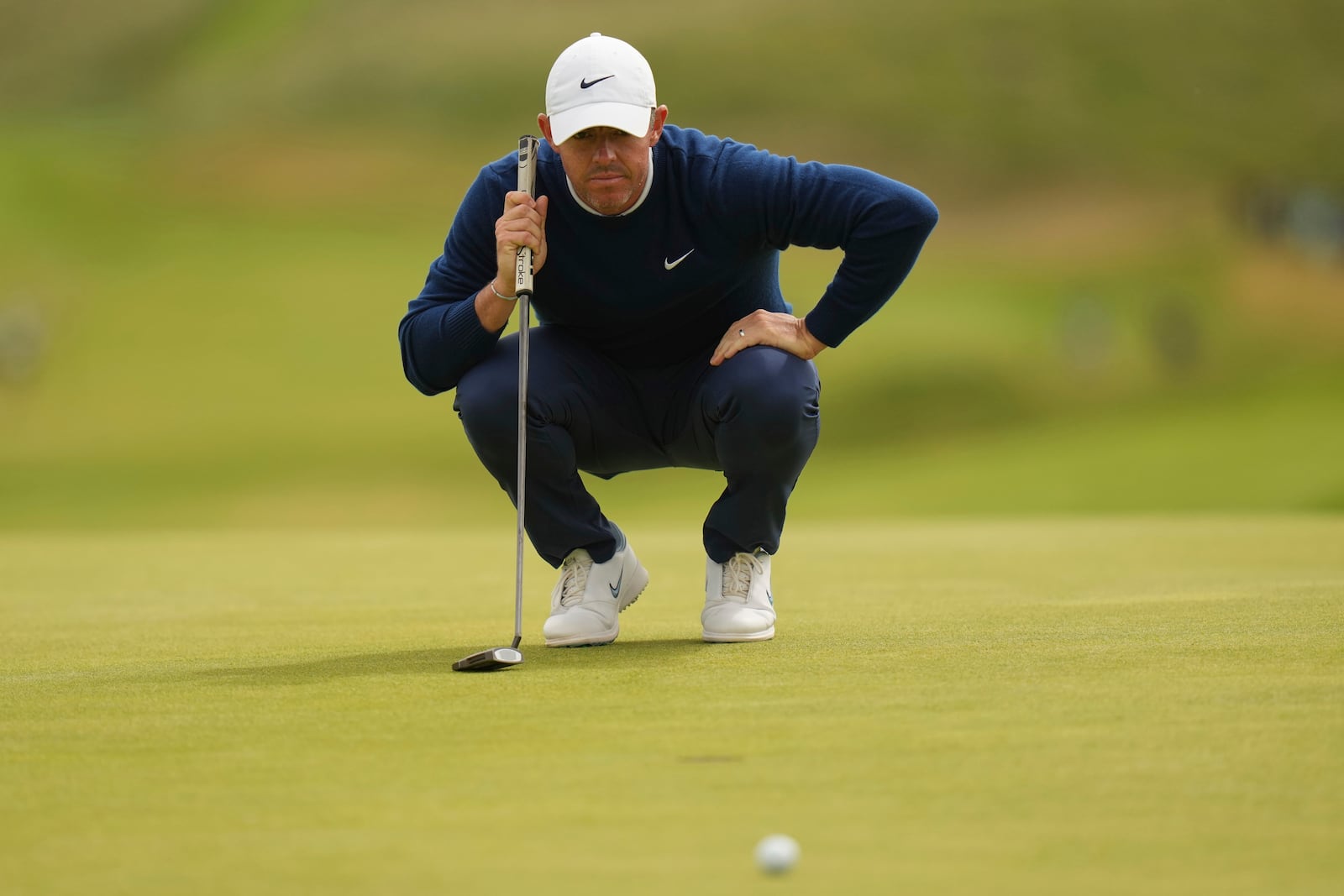 Rory McIlroy of Northern Ireland looks at his putt on the 7th green during the second round of the British Open golf championship at the Royal Portrush Golf Club, Northern Ireland, Friday, July 18, 2025. (AP Photo/Francisco Seco)