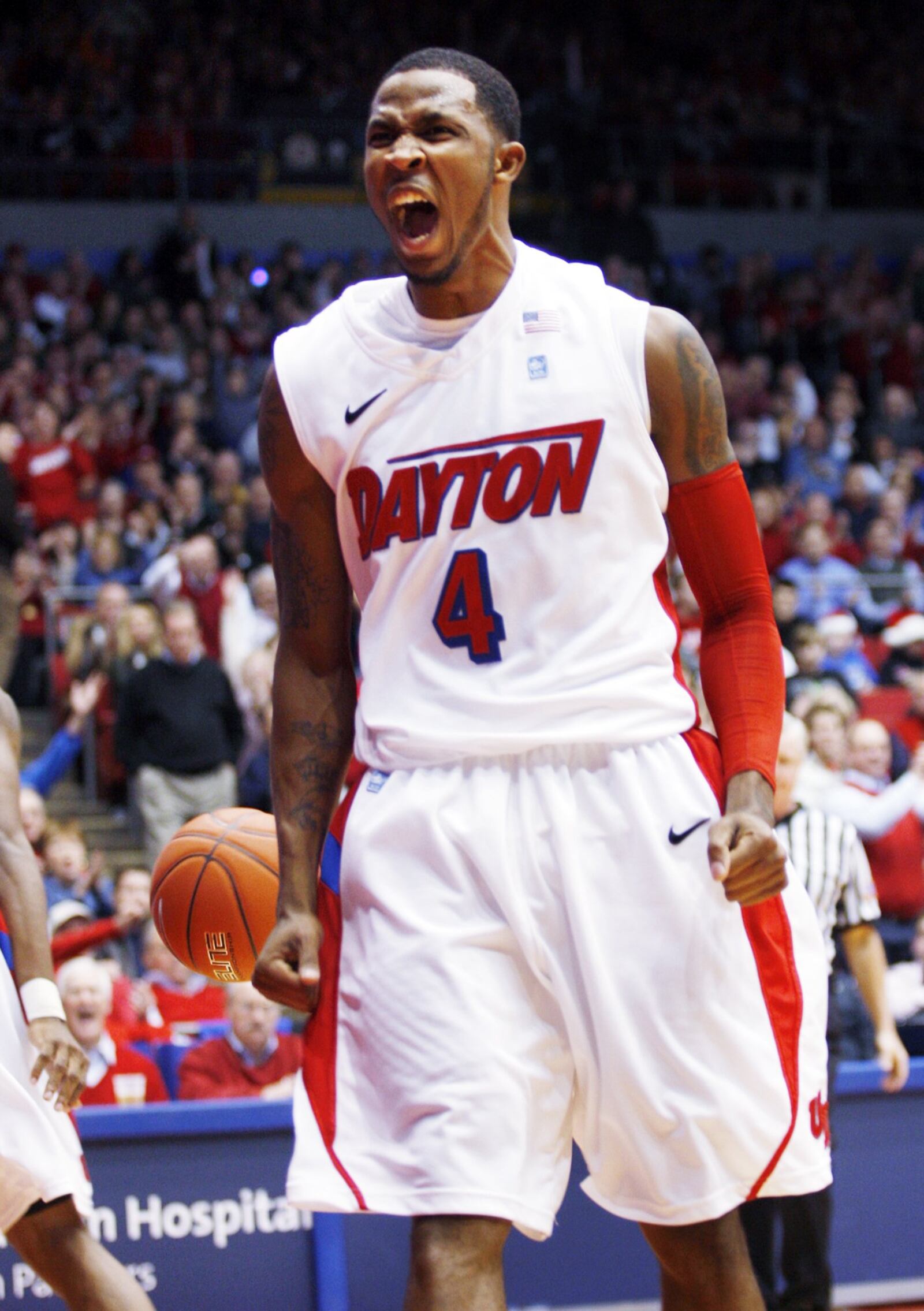 University of Dayton's Chris Johnson is fired up after Dayton takes an early lead over Alabama at University of Dayton Arena on Wednesday, Dec. 7. Staff photo by Teesha McClam