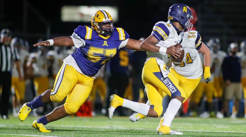 Cutline: Springfield High School's Jokell Brown brings down Toledo Whitmer quarterback Tommy Colbert during their Division I, Region 2 playoff game on Friday, Oct. 9. The Wildcats won 27-17. Brown is one of 24 seniors reurning for the Wildcats this fall. CONTRIBUTED PHOTO BY MICHAEL COOPER