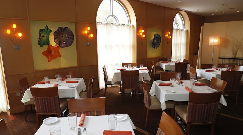 The main dining room at Mela Urban Bistro. BILL LACKEY/STAFF