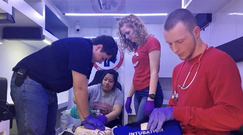 FILE: Students in Sinclair’s EMT certificate program practice in an ambulance simulator in the college’s new health sciences center. The EMT certificate program is a technical certificate.