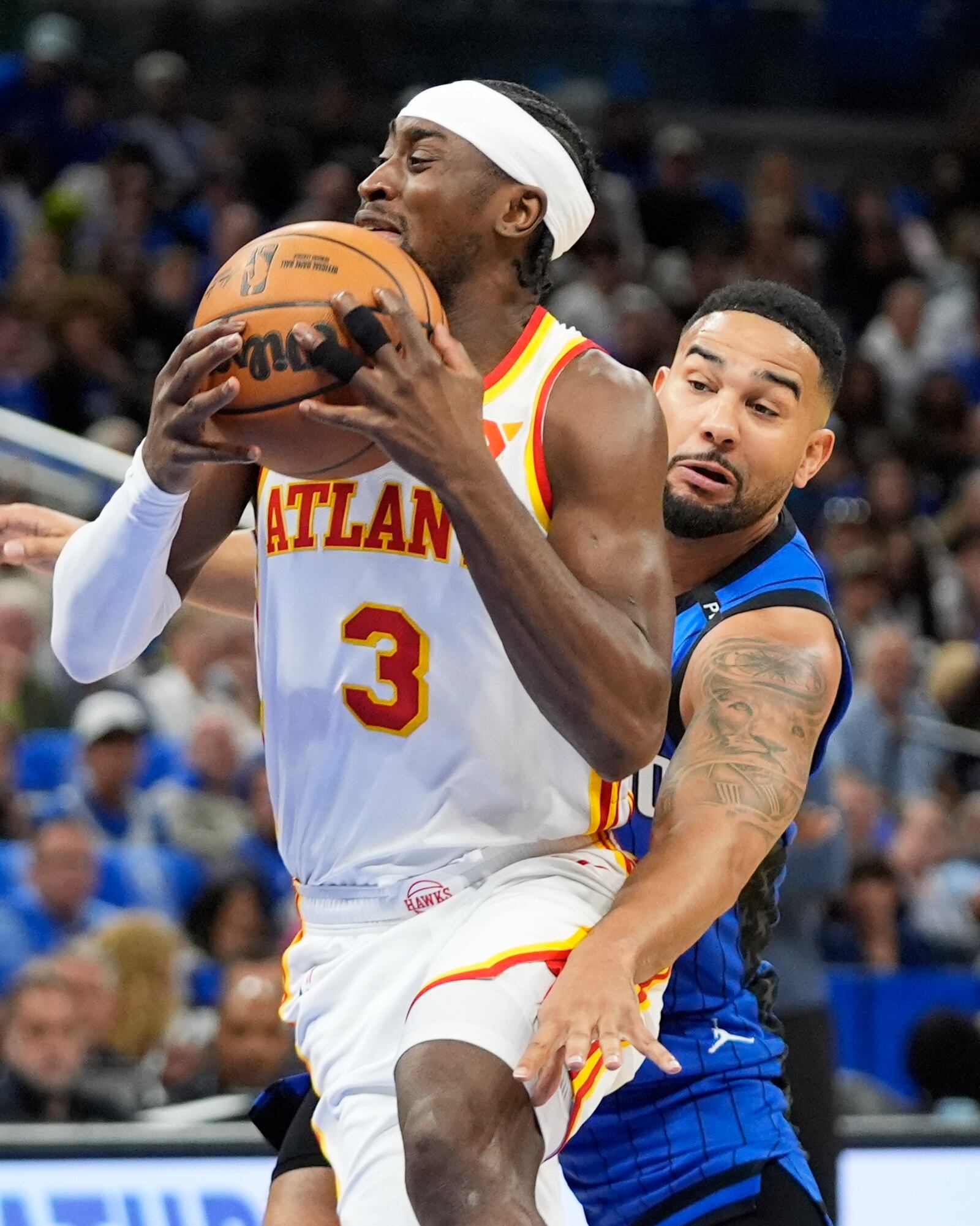Atlanta Hawks guard Caris LeVert (3) goes past Orlando Magic guard Cory Joseph on a drive to the basket during the first half of an NBA play-in tournament basketball game, Tuesday, April 15, 2025, in Orlando, Fla. (AP Photo/John Raoux)