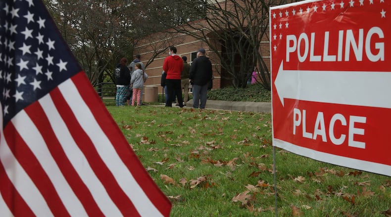 Clark County residents wait outside the Clark State Performing Arts Center to vote early Wednesday, Oct. 28, 2020. BILL LACKEY/STAFF