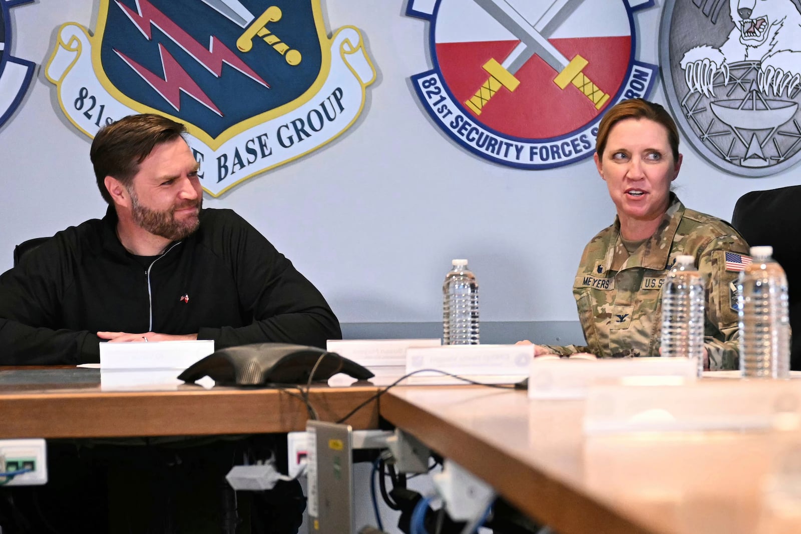 Vice President JD Vance, left, listens to Col. Susan Meyers, right, during a briefing at Pituffik Space Base in Greenland, Friday, March 28, 2025. (Jim Watson/Pool via AP)
