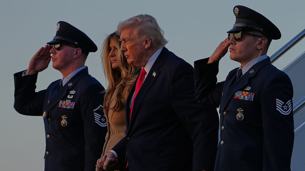 President Donald Trump and first lady Melania Trump arrive on Air Force One, at Palm Beach International Airport in West Palm Beach, Fla., Friday, Feb. 13, 2026. (AP Photo/Matt Rourke)