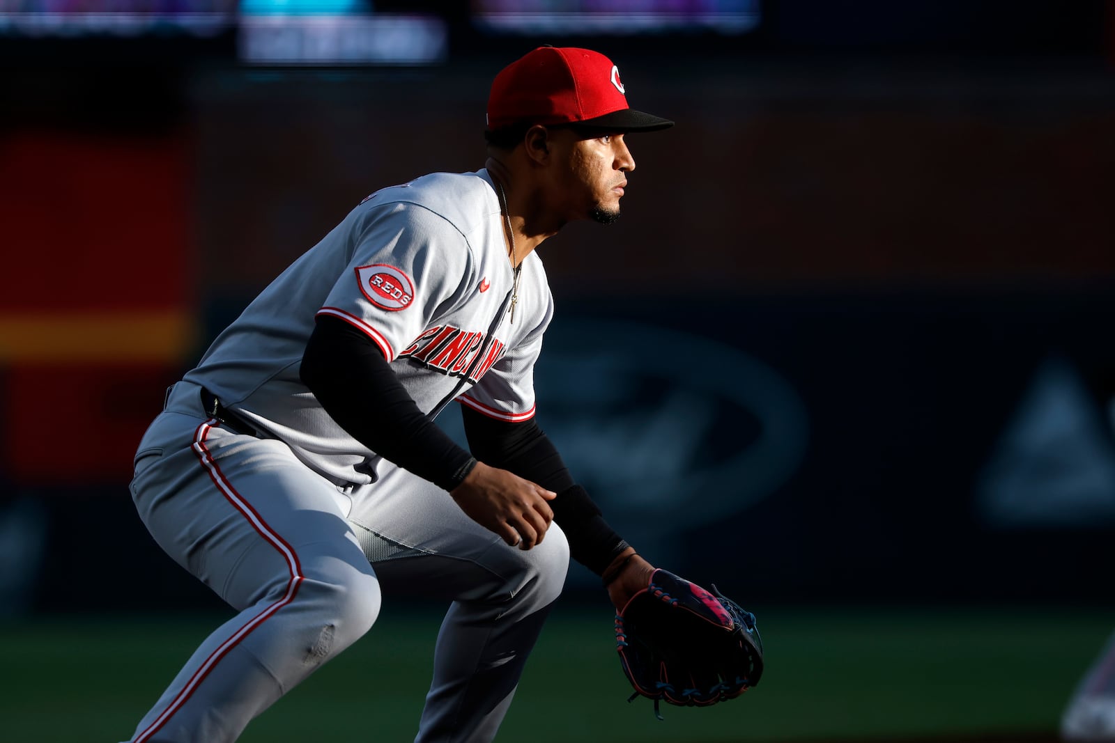 Cincinnati Reds third baseman Santiago Espinal gets ready for a play during the first inning of a baseball game against the Atlanta Braves, Monday, May 5, 2025, in Atlanta. (AP Photo/Butch Dill)
