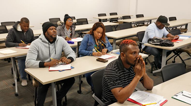 Students listen to the teacher during a class at Clark State College Wednesday, Feb. 22, 2023. BILL LACKEY/STAFF