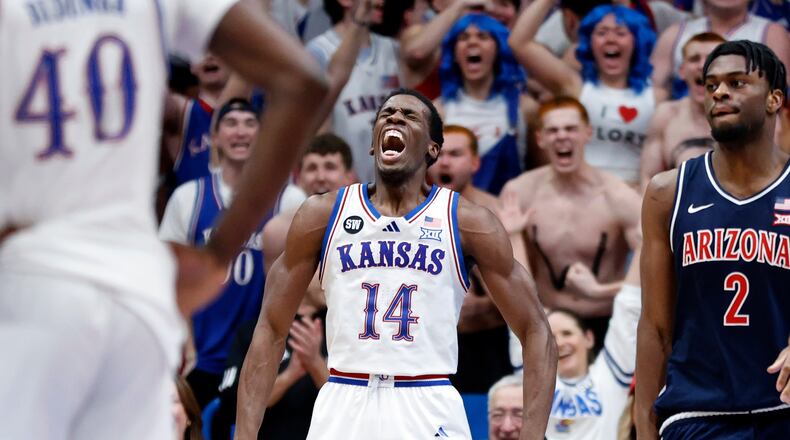 Kansas guard Melvin Council Jr. (14) reacts after scoring during the second half of an NCAA college basketball game against Arizona, Monday, Feb. 9, 2026, in Lawrence, Kan. (AP Photo/Colin E. Braley)