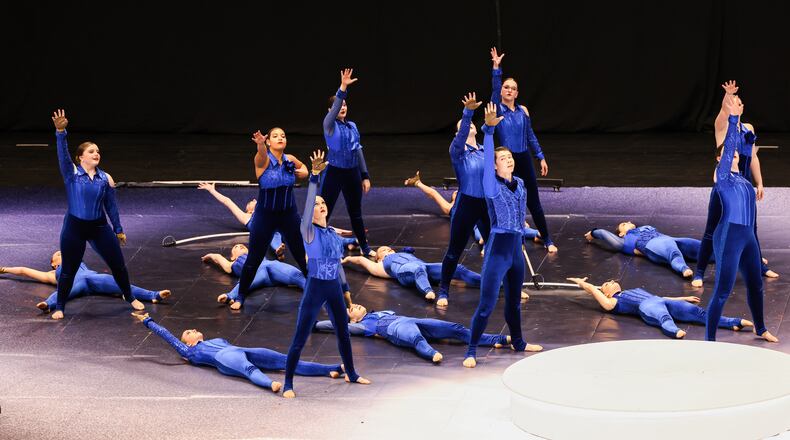 Members of Bellbrook High School's color guard perform during the Winter Guard International's World Championships Scholastic Semifinals on Friday morning at University of Dayton Arena. The event is taking place at multiple venues this weekend, including Wright State University's Nutter Center. Finals will take place Saturday at UD Arena. BRYANT BILLING / STAFF