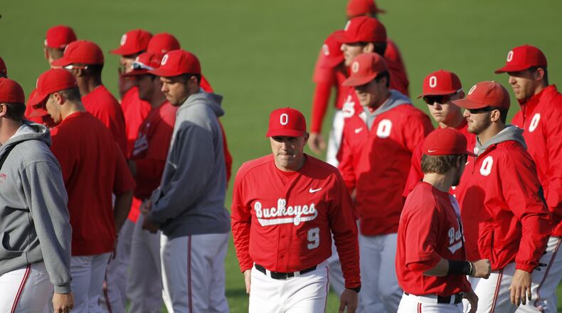 Ohio State baseball coach Greg Beals, a Kenton Ridge graduate, heads back to the dugout after talking to his players before a game against Ball State at Bill Davis Stadium in Columbus on Wednesday, April 16, 2014. David Jablonski/Staff