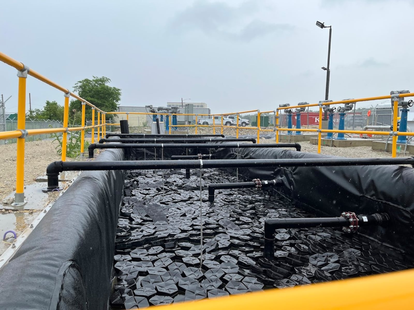 A basin of water on Wright-Patterson Air Force Base on Thursday June 5, 2025, part of a system designed to capture and filter contaminants from water on the base's Area B. THOMAS GNAU/STAFF