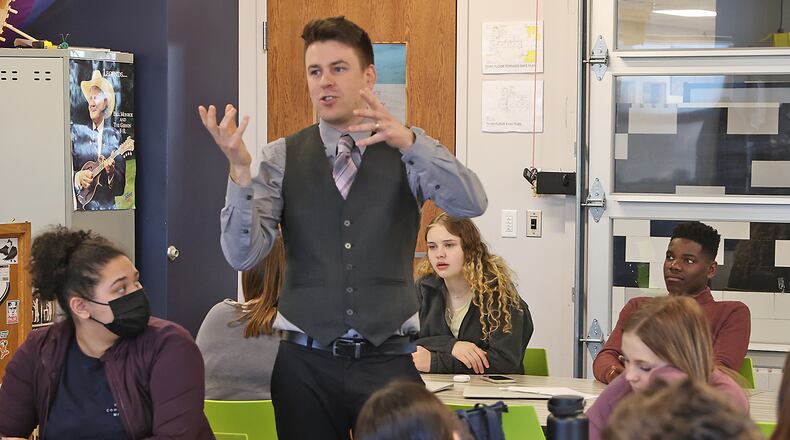 Brandon Williams teaches 8th grade history at the Global Impact STEM Academy. BILL LACKEY/STAFF