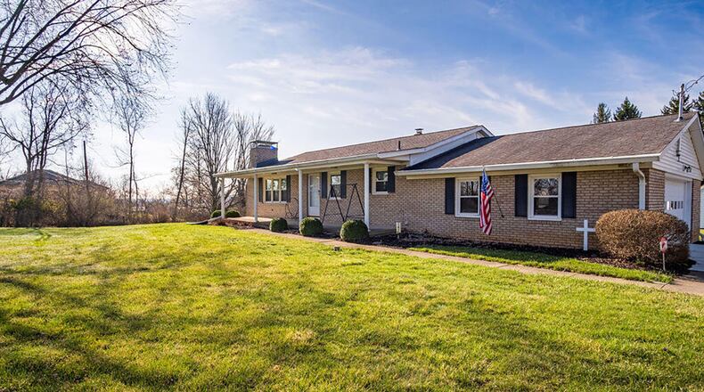 The 3-bedroom, all-brick ranch home sits on 1.57 acres and has about 1,680 sq. ft. of living space with an unfinished, walk-out basement. The home has a side-entry, 2-car garage. CONTRIBUTED PHOTO