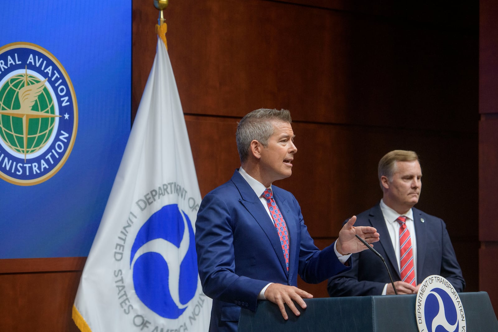 Acting FAA Administrator Chris Rocheleau, right, listens as Secretary of Transportation Sean Duffy speaks during a news conference to provide a status update on Newark Liberty International Airport at the Department of Transportation in Washington, Wednesday, May 28, 2025. (AP Photo/Rod Lamkey, Jr.)