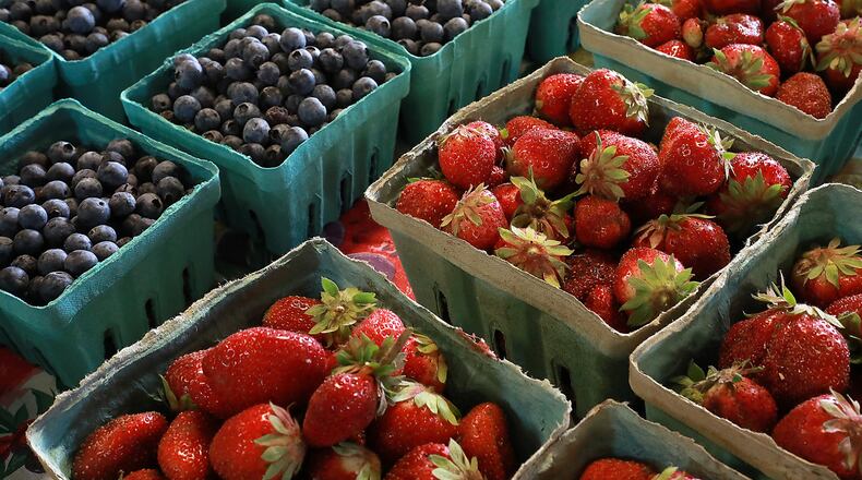 Fresh strawberries and blueberries at the Corn Crib Farm Market. BILL LACKEY/STAFF