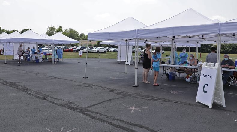 A free COVID-19 testing clinic is set up in the rear parking lot at Hayward Middle School Wednesday. BILL LACKEY/STAFF