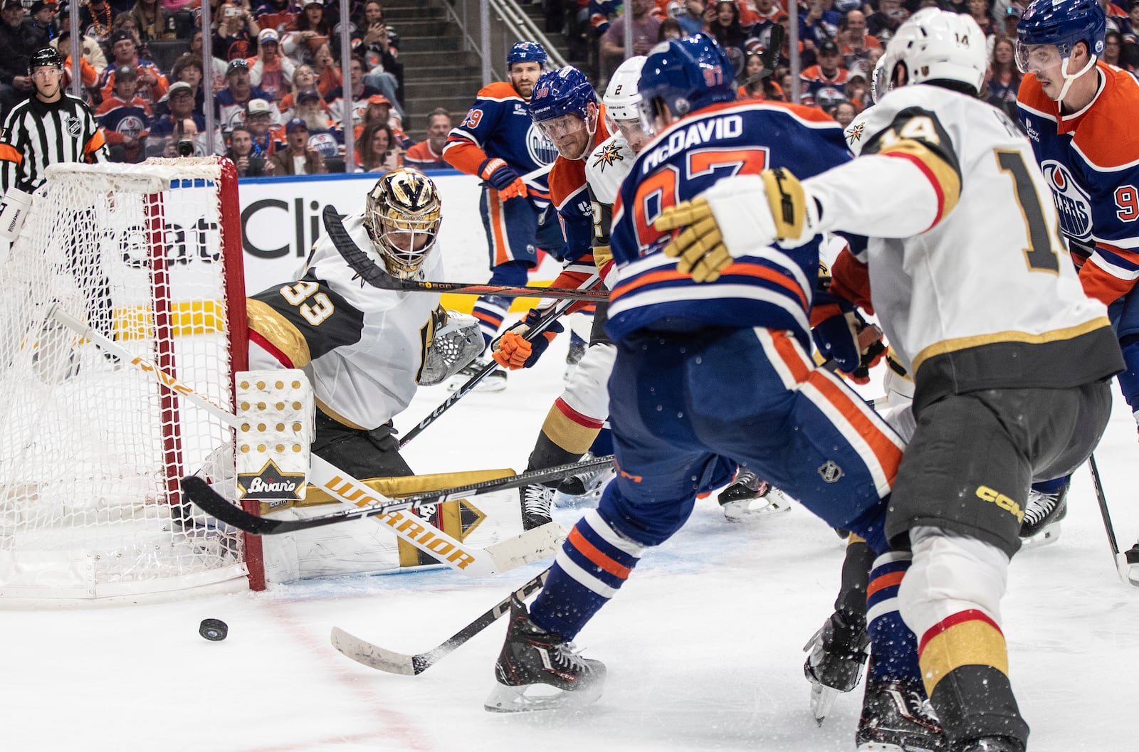 Vegas Golden Knights goalie Adin Hill (33) makes a save against Edmonton Oilers' Connor McDavid (97) during the second period of Game 3 of a second-round NHL hockey playoff series in Edmonton, Alberta, Saturday, May 10, 2025. (Jason Franson/The Canadian Press via AP)