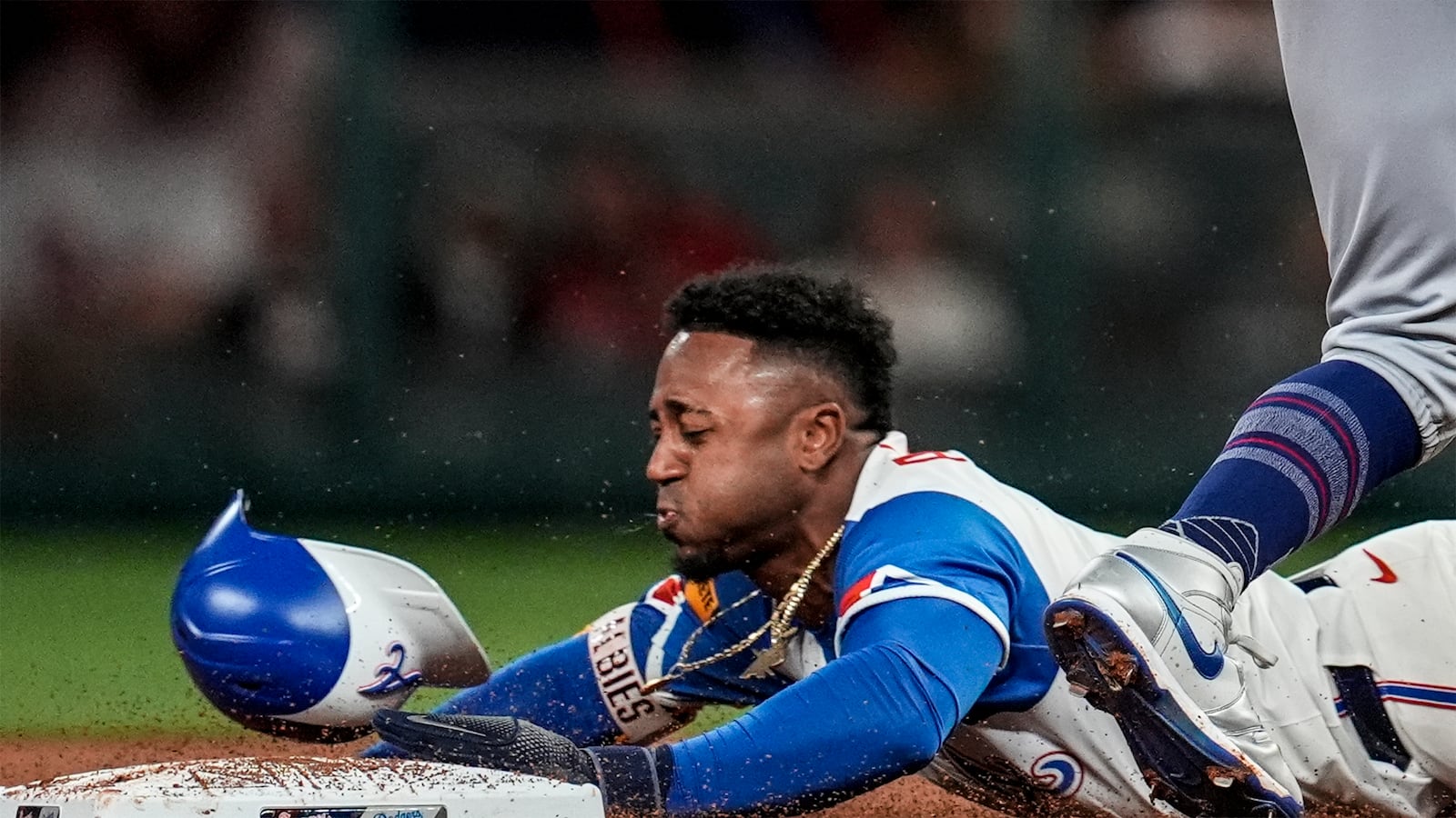 Atlanta Braves' Ozzie Albies (1) steals second base against Los Angeles Dodgers shortstop Mookie Betts (50) in the second inning of a baseball game, Saturday, May 3, 2025, in Atlanta. (AP Photo/Mike Stewart)