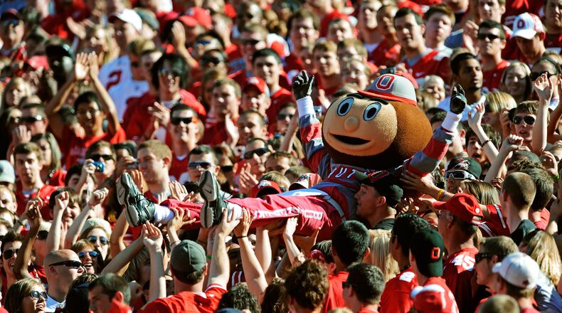 COLUMBUS, OH - SEPTEMBER 25: Mascot Brutus Buckeye is carried up the stands by fans during a game against the Eastern Michigan Eagles at Ohio Stadium on September 25, 2010 in Columbus, Ohio. (Photo by Jamie Sabau/Getty Images)