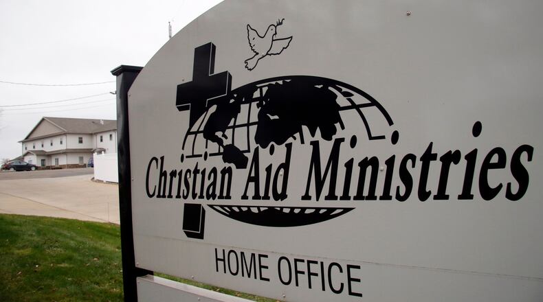 FILE - A sign for the Christian Aid Ministries offices is seen in Berlin, Ohio, Dec. 16, 2021. (AP Photo/Tom E. Puskar, File)