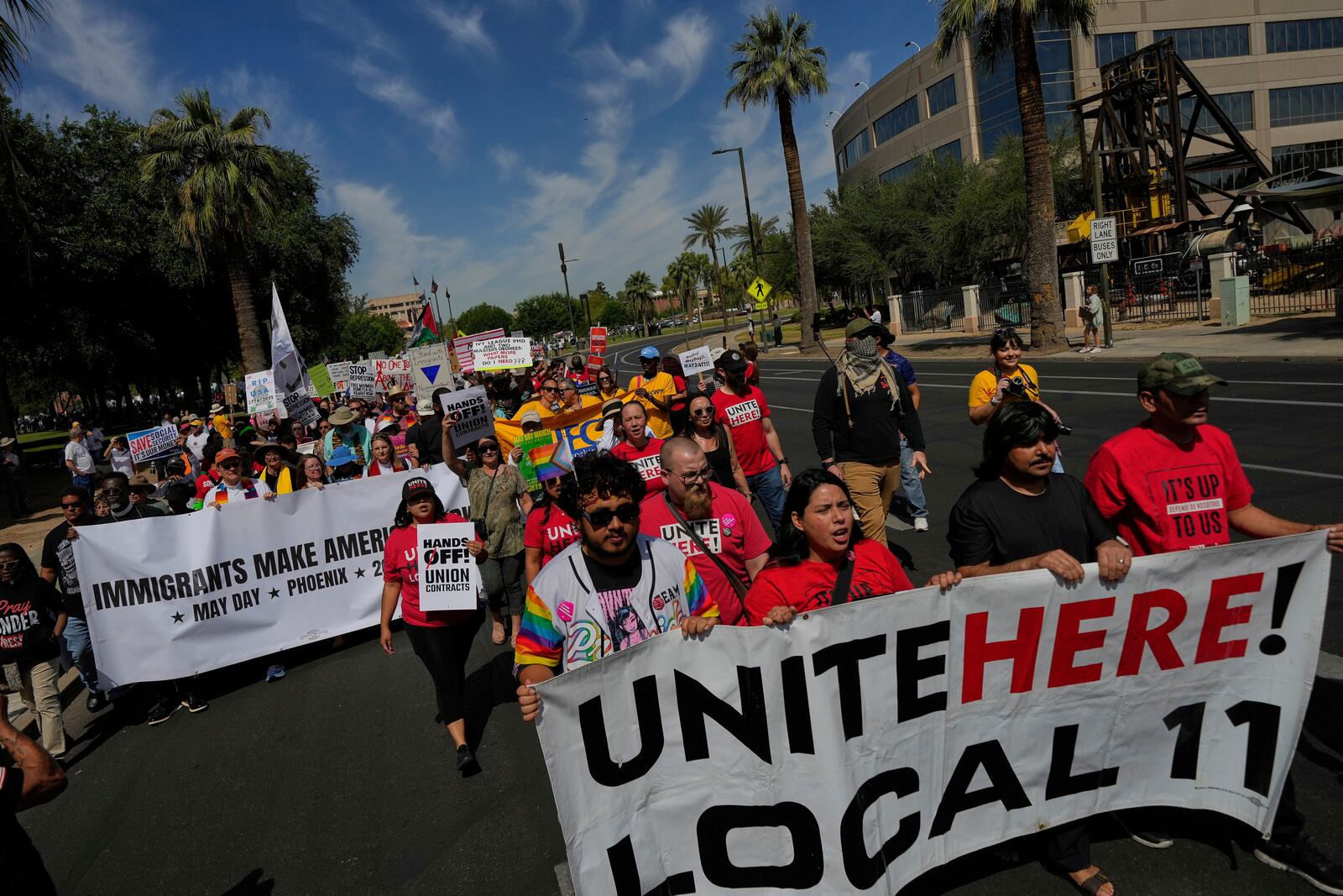 Demonstrators march during a May Day protest at the Capitol, Thursday, May 1, 2025, in Phoenix. (AP Photo/Matt York)
