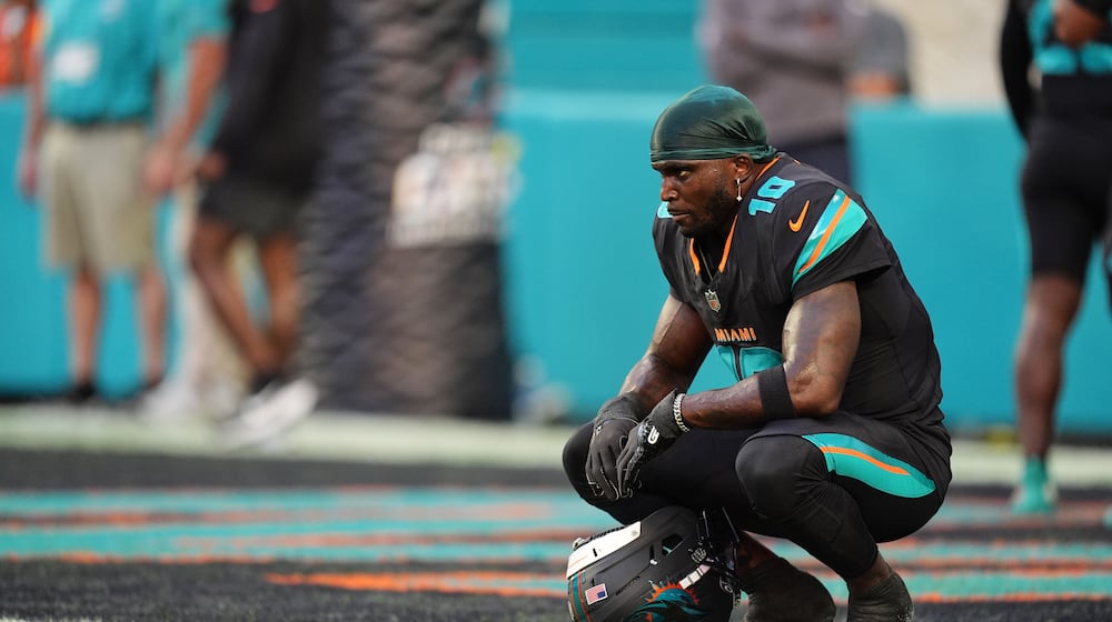 FILE - Miami Dolphins' Tyreek Hill looks toward the field son the sideline before an NFL football game against the New York Jets, Sept. 29, 2025, in Miami Gardens, Fla. (AP Photo/Rebecca Blackwell, file)