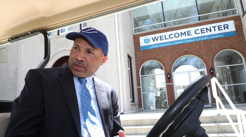 Dr. Christopher Washington, president of Urbana University, pauses outside the new Urbana Univsersity Welcome Center as he talks about the improvements that school has undergone in the past year. Bill Lackey/Staff