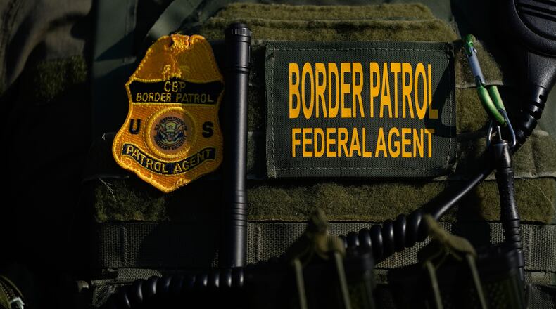 FILE - A Federal Patrol agent's badge is seen near an Immigration and Customs Enforcement facility in Broadview, Ill., Oct. 3, 2025. (AP Photo/Erin Hooley, File)