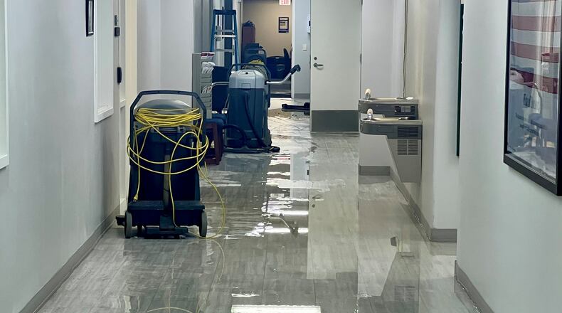 Flooding at Springview Government Center was caused by a water pipe that burst near the men's restroom on the first floor. CONTRIBUTED