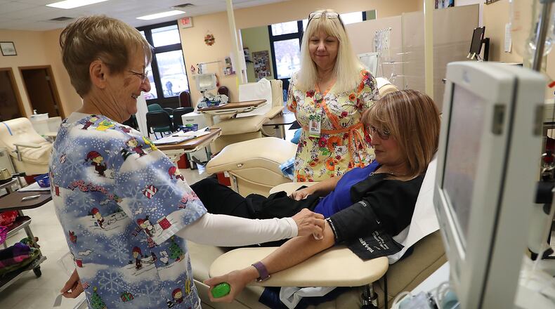 The Community Blood Center is hosting several drives in Clark and Champaign counties this month. Here, Kelly Skelton talks with Beryl Boggess, left, and Theresa Burns as she gets ready to donate blood at the Community Blood Center. BILL LACKEY/STAFF
