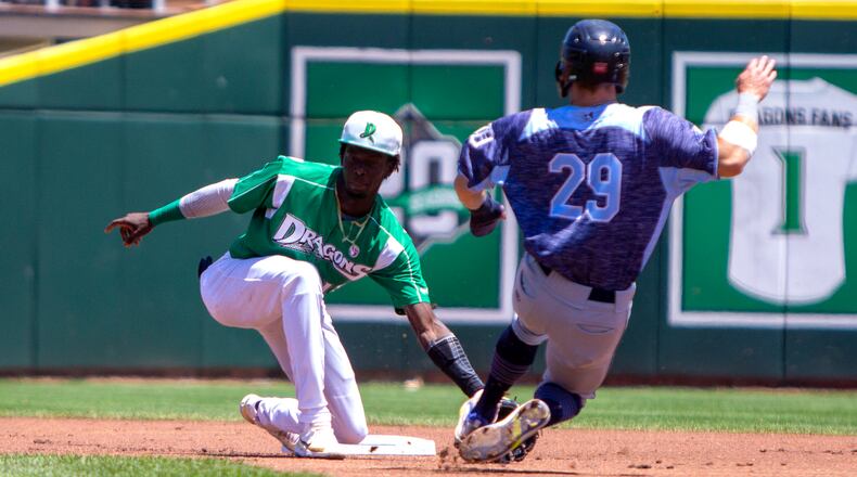 Dragons shortstop Elly De La Cruz tags out West Michigan's Ben Malgeri on a steal attempt on a throw from catcher Mat Nelson during Sunday's game at Dayair Ballpark.