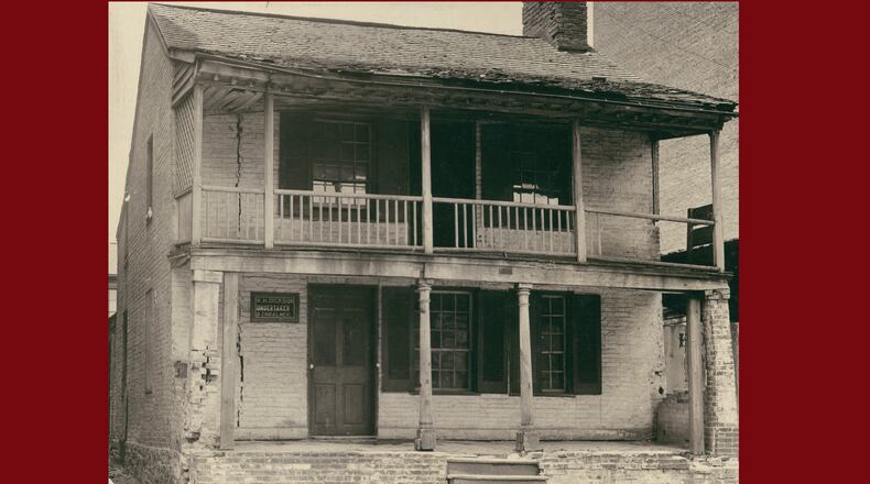 W.H. Dickson was born in Tennessee in 1840 into a free black farming family. For a short period of time in the early 1890s, he worked as an undertaker and embalmer and had a blacksmith shop in the back of this building on North Fountain Avenue, shown here around 1895.  Photo Courtesy of the Clark County Historical Society