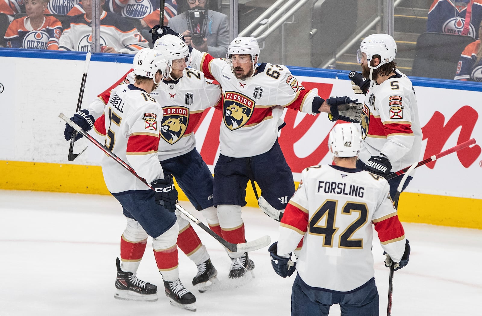 Florida Panthers centerBrad Marchand (63) celebrates with teammates after his goal against the Edmonton Oilers during the first period in Game 5 of the NHL hockey Stanley Cup Final in Edmonton, Alberta, Saturday, June 14, 2025. (Jason Franson/The Canadian Press via AP)