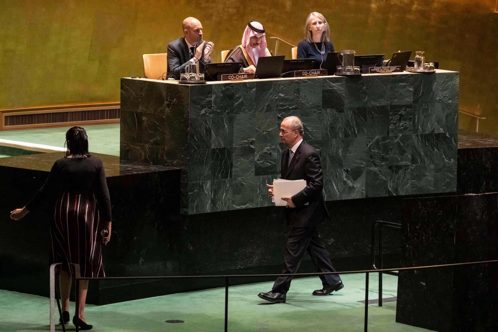 Palestinian Prime Minister Mohammed Mustafa walks off stage after speaking at a high-level International Conference for the Peaceful Settlement of the Question of Palestine and the Implementation of the Two-State solution at United Nations Headquarters, on Monday, July 28, 2025. (AP Photo/Adam Gray)