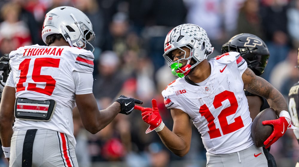 Ohio State running back CJ Donaldson Jr. (12) celebrates with tight end Jelani Thurman (15) after scoring during the second half of an NCAA college football game against Purdue, Saturday, Nov. 8, 2025, in West Lafayette, Ind. (AP Photo/Doug McSchooler)