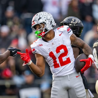 Ohio State running back CJ Donaldson Jr. (12) celebrates with tight end Jelani Thurman (15) after scoring during the second half of an NCAA college football game against Purdue, Saturday, Nov. 8, 2025, in West Lafayette, Ind. (AP Photo/Doug McSchooler)