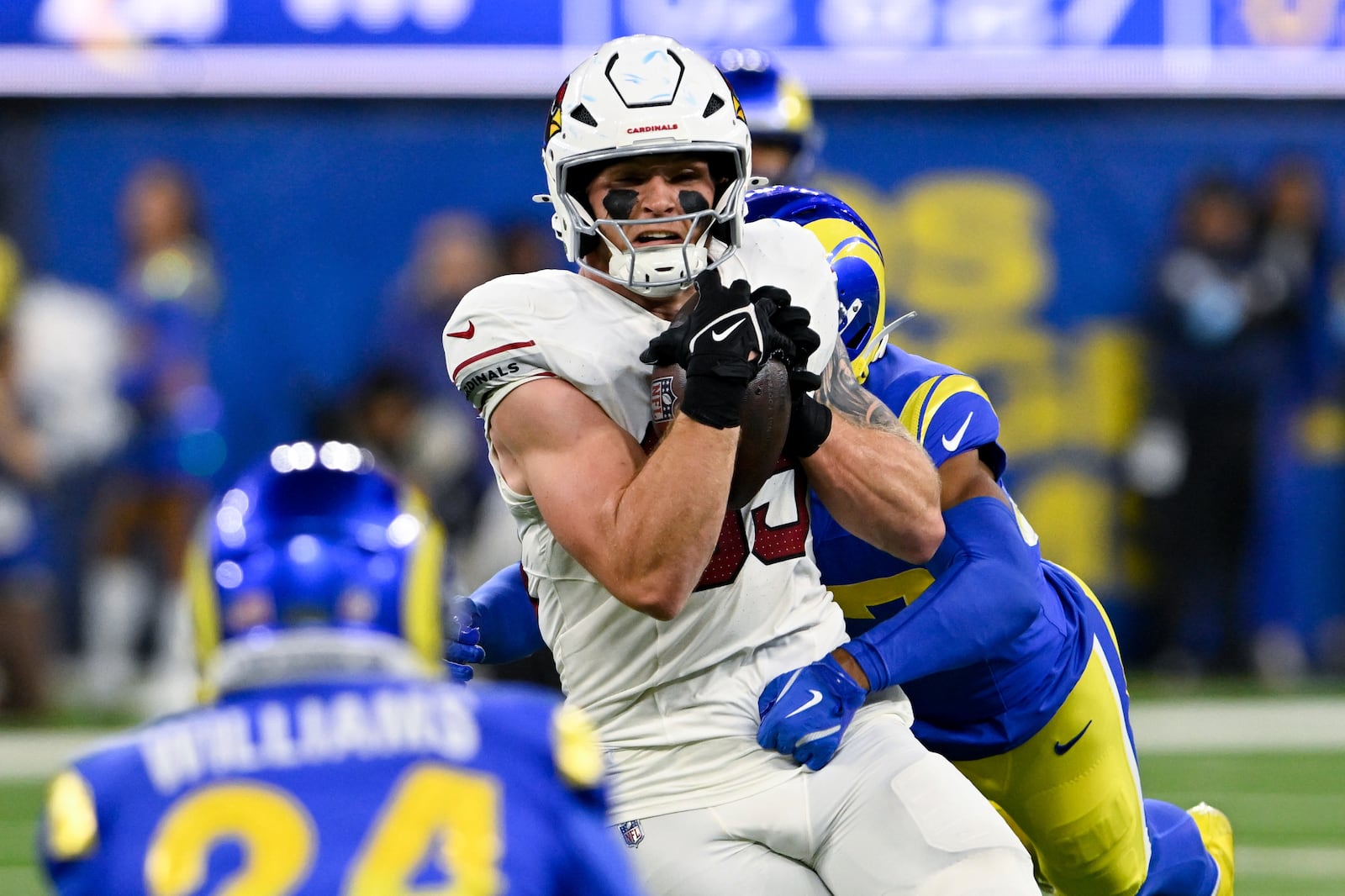 FILE - Arizona Cardinals tight end Trey McBride (85) makes a catch while Los Angeles Rams safety Quentin Lake tackles him during the first half of an NFL football game Saturday, Dec. 28, 2024, in Inglewood, Calif. (AP Photo/Alex Gallardo, File)