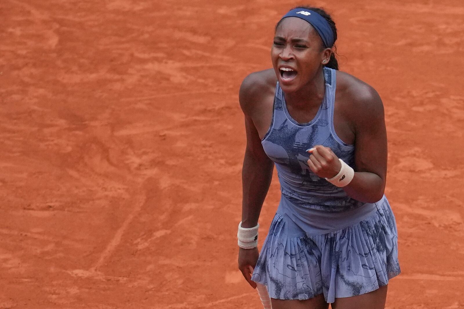 Coco Gauff of the U.S. celebrates beating Marie Bouzkova of the Czech Republic during their third round match of the French Tennis Open, at the Roland-Garros stadium, in Paris, Saturday, May 31, 2025. (AP Photo/Christophe Ena)