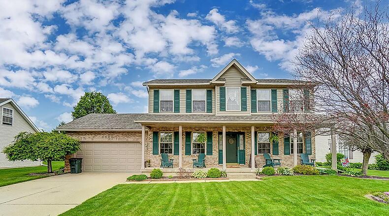 The 2-story has 3, possibly 4, bedrooms and a finished basement. A concrete drive leads to the attached, 2-car, oversized garage. The front of the home is covered in brick with vinyl siding and has a full, covered front porch. CONTRIBUTED PHOTO