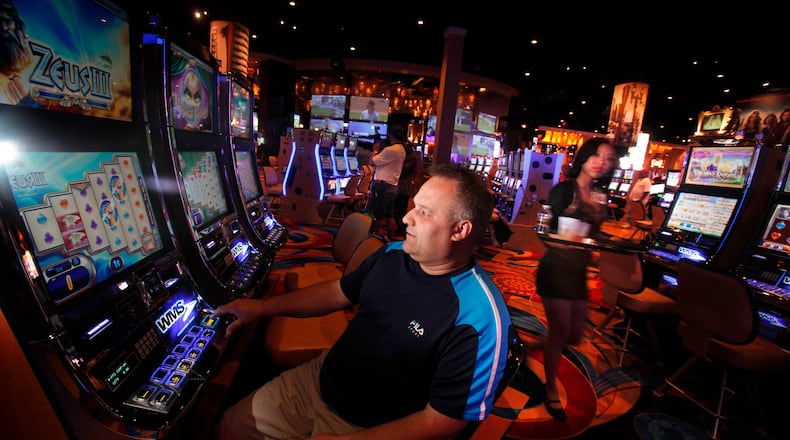 James Cairl from Toledo tries his luck on the floor of the Hollywood Casino in Columbus in a 2015 photo. (Dispatch photo by Tom Dodge)