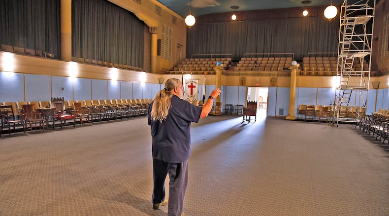 Arliss Wooten talks about one of the large meeting rooms as he gives a tour of the Springfield Masonic Center on West High Street Tuesday, March 23, 2024. To celebrate the building's 100th year, the Mason's are holding an open house so the members of the community can tour the Masonic Center. BILL LACKEY/STAFF