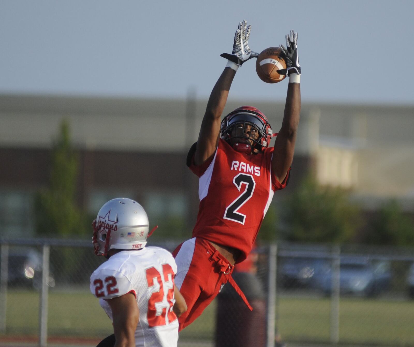 Trotwood’s Dallas Daniels goes for a catch over Kobe Feltner. Trotwood-Madison defeated Troy 48-0 in a Week 1 high school football game on Friday, Aug. 25, 2017. MARC PENDLETON / STAFF