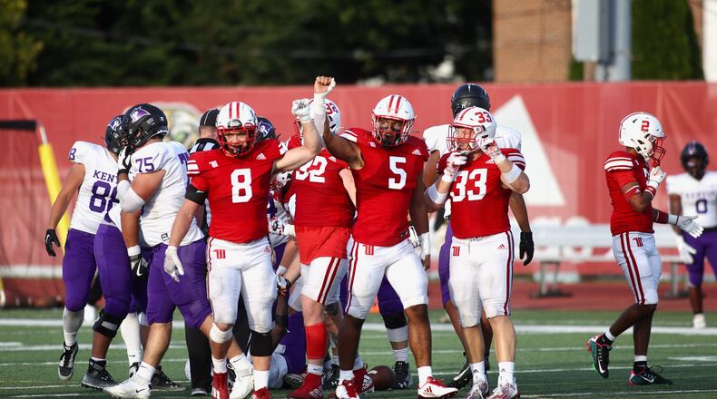 Wittenberg defenders, including Dane Flatter (8), Mario Getaw (5) and Cameron Snurr (33) prepare for a play against Kenyon on Saturday, Sept. 16, 2023, at Edwards-Maurer Field in Springfield. David Jablonski/Staff