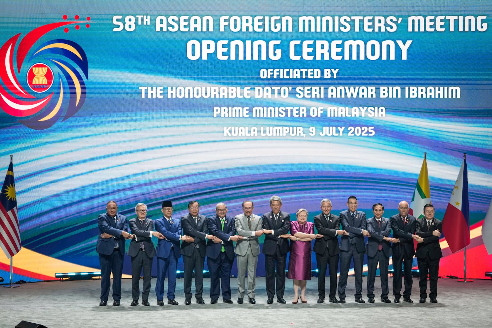 From left to right, East Timor Foreign Minister Bendito dos Santos Freitas, Lao Minister of Affairs Thongsavanh Phomvihane, Indonesia's Foreign Minister Sugiono, Cambodia's Foreign Minister Prak Sokhonn, Brunei's Minister of Foreign Affairs Erywan Yusof, Malaysia's Prime Minister Anwar Ibrahim, Malaysia's Foreign Affairs Minister Mohamad Hasan, Philippine Foreign Secretary Theresa Lazaro, Singapore's Foreign Minister Vivian Balakrishnan, Thailand's Foreign Minister Maris Sangiampongsa, Vietnam's Foreign Minister Bui Thanh Son, Myanmar Ministry of Foreign Affairs representative Kyaw Nyun Oo and ASEAN's Secretary-General Kao Kim Hourn pose for the group photo during the opening ceremony of the Association of Southeast Asian Nations (ASEAN) Foreign Ministers' meeting and related meetings at the Convention Centre in Kuala Lumpur, Malaysia, Wednesday, July 9, 2025. (AP Photo/Vincent Thian)