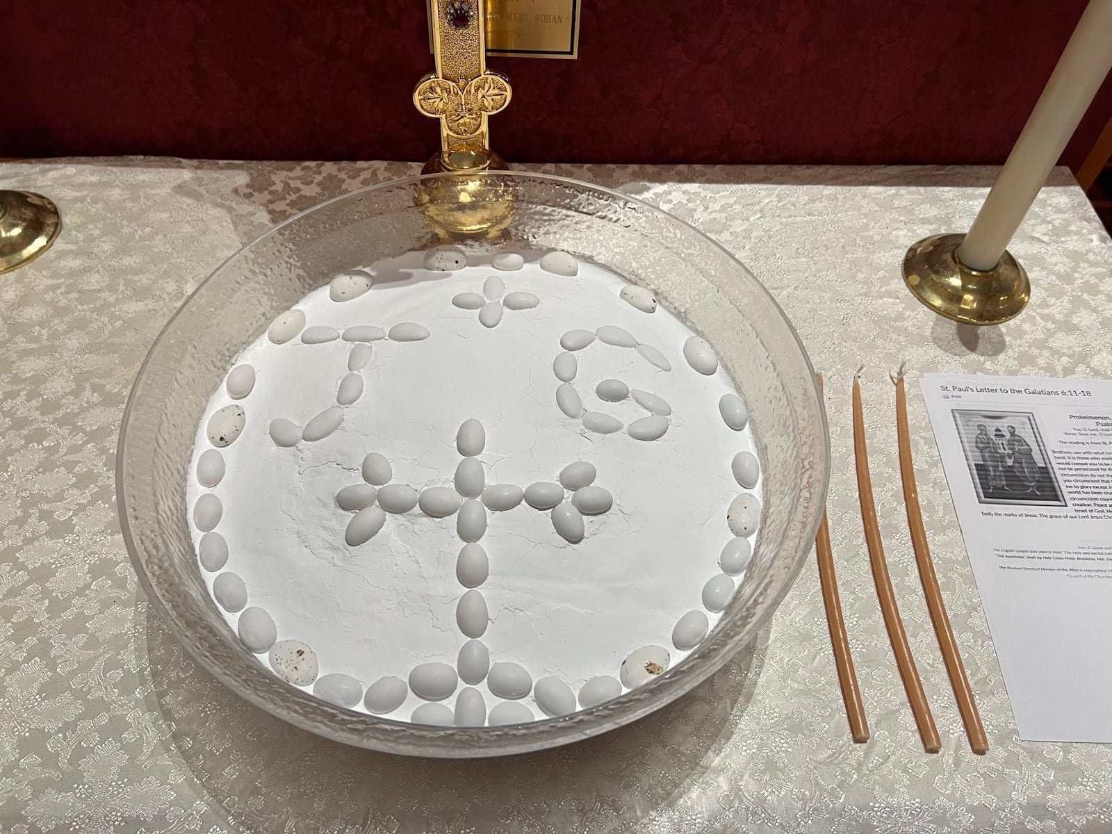 Springfield’s Anna Plataniotis uses White Jordan Almonds to sculp a cross and the initials of the person being memorialized on the powdered sugar topping of her kolivas, in this case, the late Dr. James Gianakoupoulous. Anna Plataniotis/CONTRIBUTOR