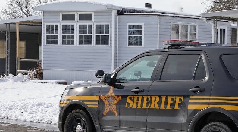 A Clark County Sheriff’s cruiser sits in front of a mobile home at 15 Larkspur Drive in the Brookside Mobile Home Park on Wednesday. A joint effort by four sheriff’s offices led to a large drug seizure. Early on Dec. 13, investigators from the Clark, Ross, Highland and Clinton county sheriff’s offices conducted a narcotics search warrant at addresses at 15 Larkspur Drive and 18 Larkspur Drive at the Brookside Mobile Home Park in Pleasant Twp., Clark County. Investigators recovered approximately five kilos of methamphetamine, two kilos of cocaine, 25 pounds of marijuana and several different types of narcotic pills. BILL LACKEY/STAFF