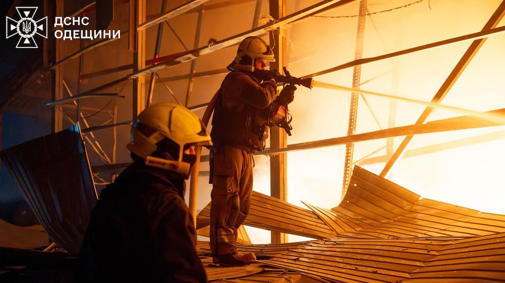 In this photo provided by the Ukrainian Emergency Service, emergency services personnel work to extinguish a fire following a Russian attack in Odesa region, Ukraine, Thursday, Jan. 29, 2026. (Ukrainian Emergency Service via AP)