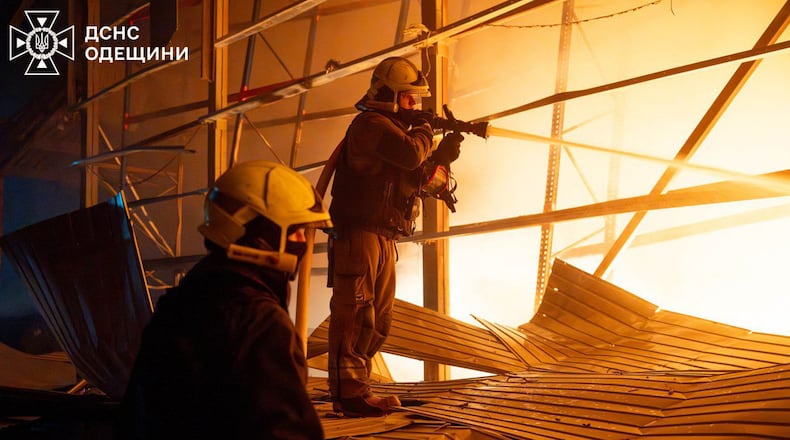 In this photo provided by the Ukrainian Emergency Service, emergency services personnel work to extinguish a fire following a Russian attack in Odesa region, Ukraine, Thursday, Jan. 29, 2026. (Ukrainian Emergency Service via AP)