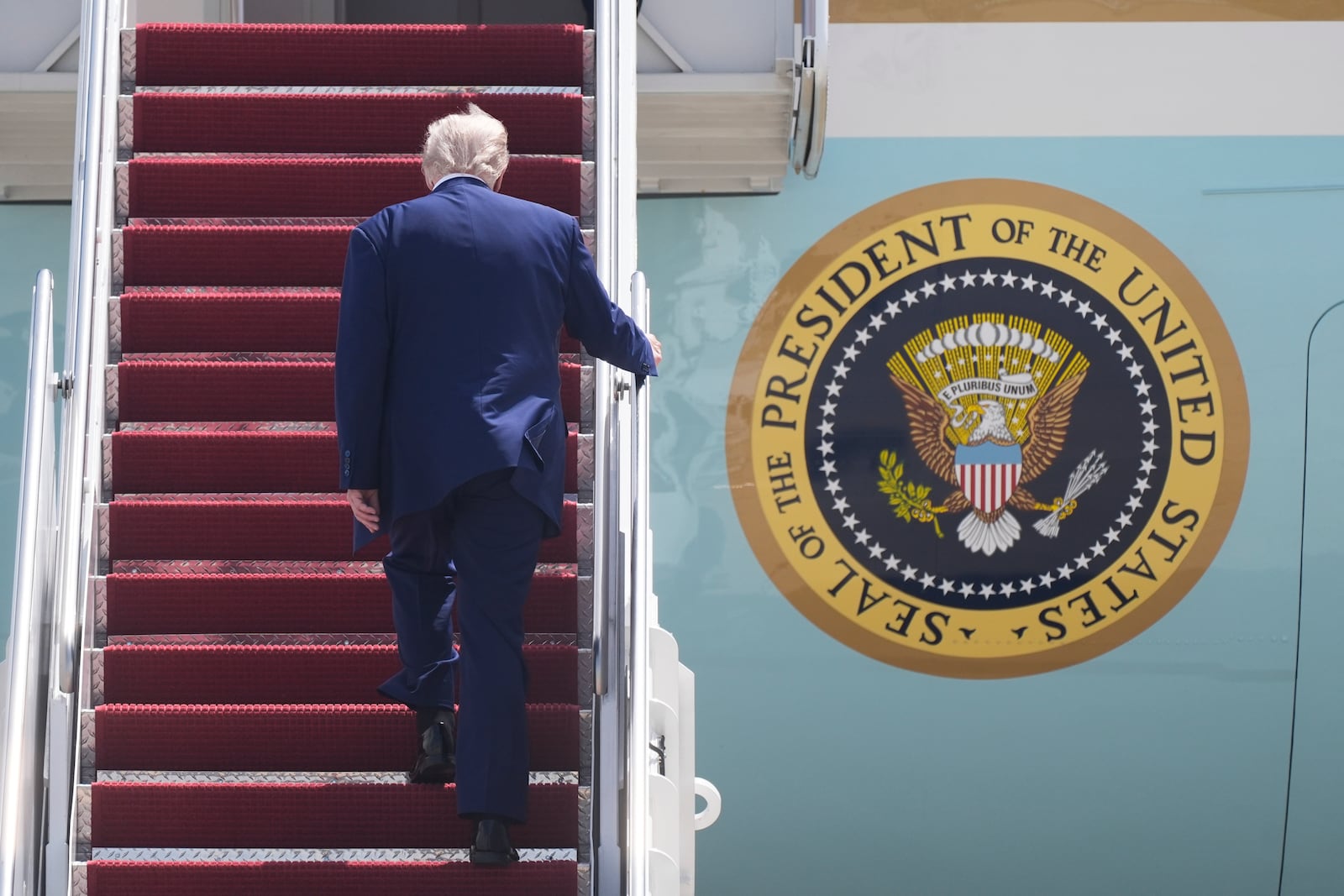 President Donald Trump boards Air Force One at Joint Base Andrews, Md., on his way to Riyadh, Saudi Arabia, Monday, May 12, 2025. (AP Photo/Manuel Balce Ceneta)